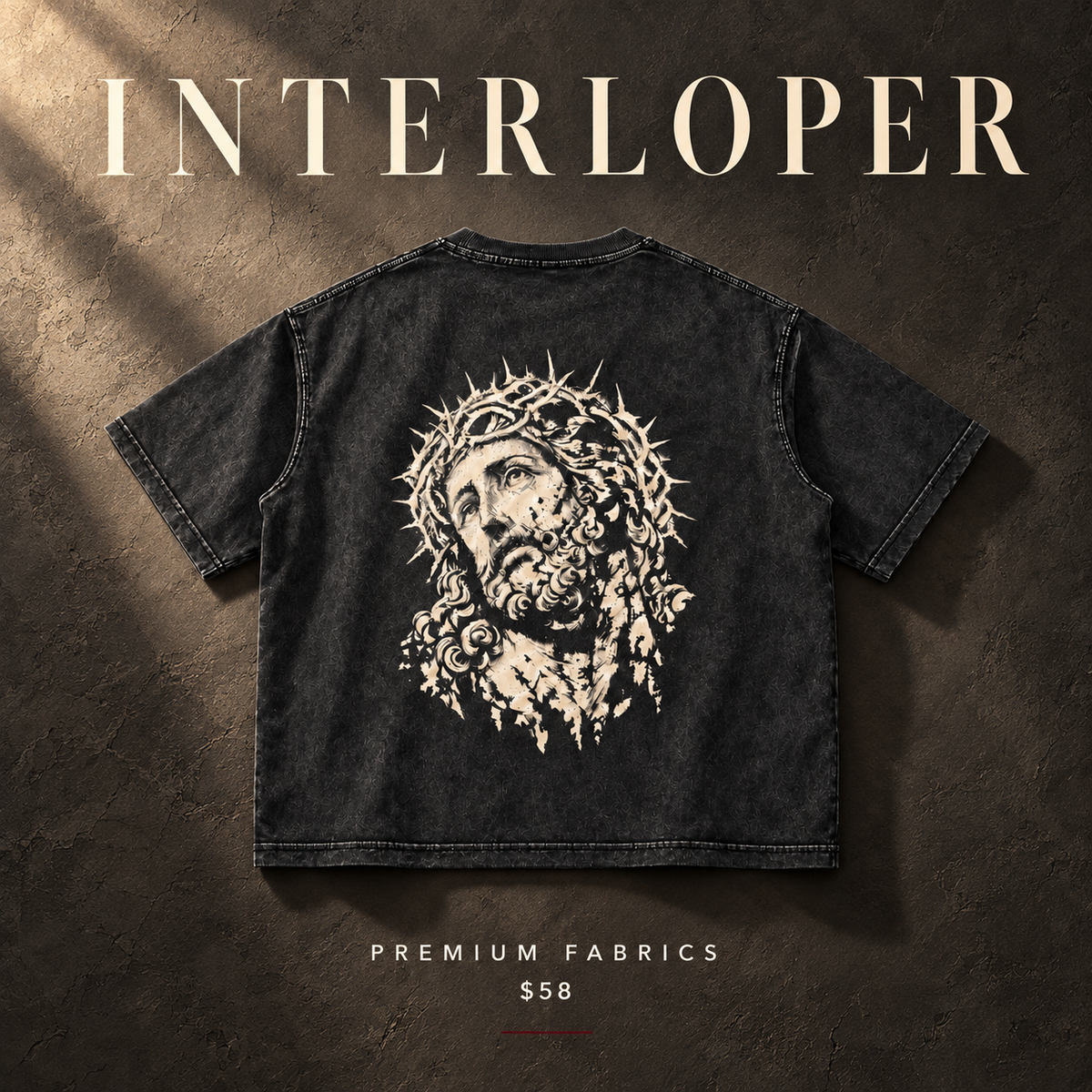 A black washed short-sleeve T-shirt shown from the back, featuring a large white graphic of Jesus with a crown of thorns. The shirt is displayed on a textured dark brown background with dramatic lighting, and the text 'INTERLOPER' appears at the top, 'PREMIUM FABRICS' at the bottom, and '$58' below.